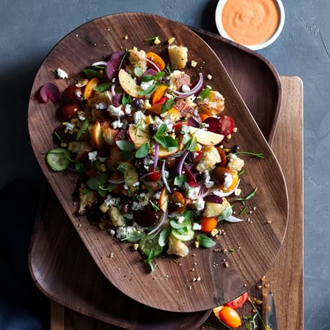 This gorgeous panzanella salad is fresh, vibrant, and makes use of two of summer's most delicious yields - peaches and tomatoes. Toss it together and bring it to picnics and dinner parties. Photo from Williams Sonoma