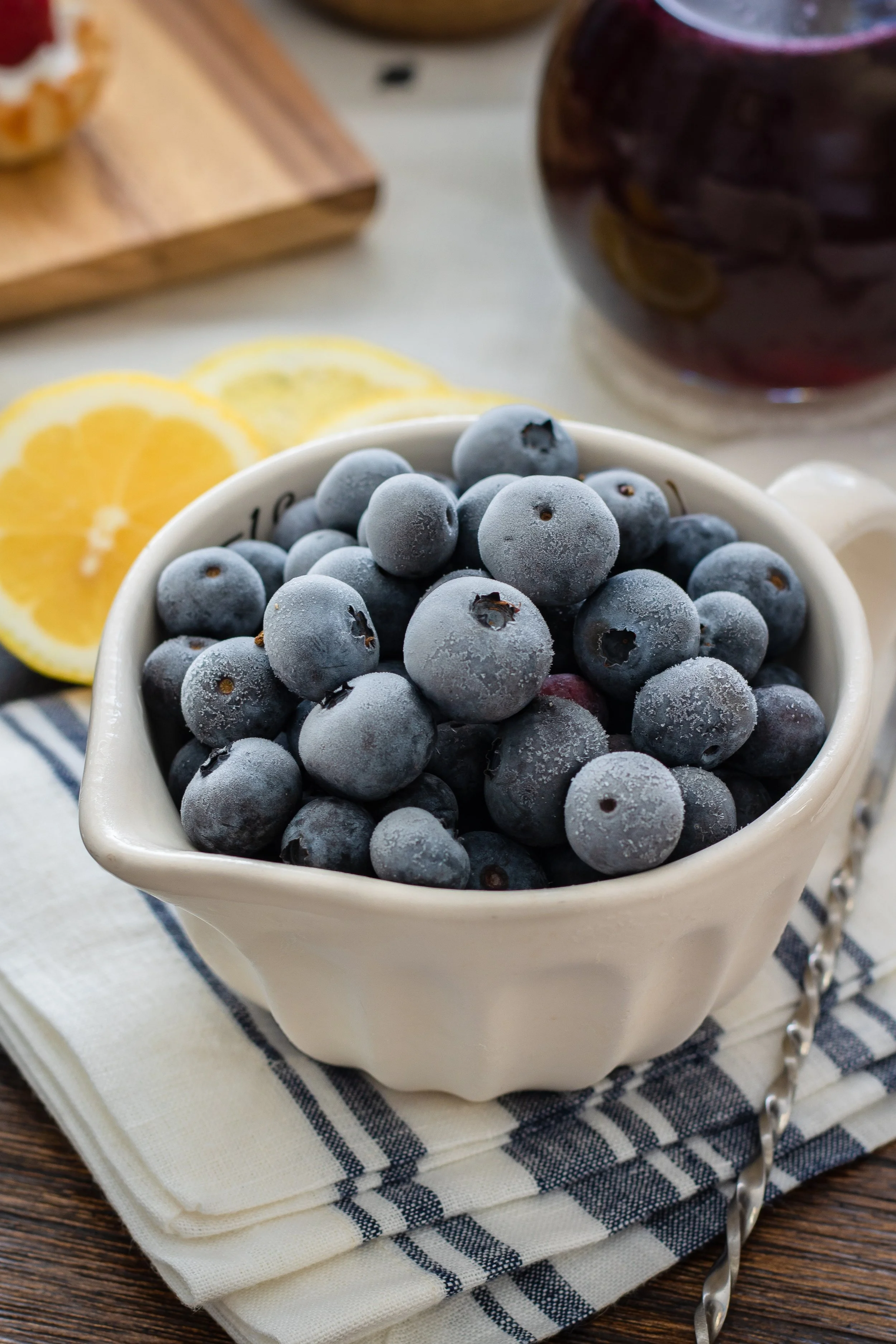 One of the simplest solutions is to chop up your fruit (unless they're berries!), stick it in a plastic ziplock bag, and throw it into the freezer. When you’re ready for a refreshing treat, blend the fruit chunks into smoothies or just eat them as is.