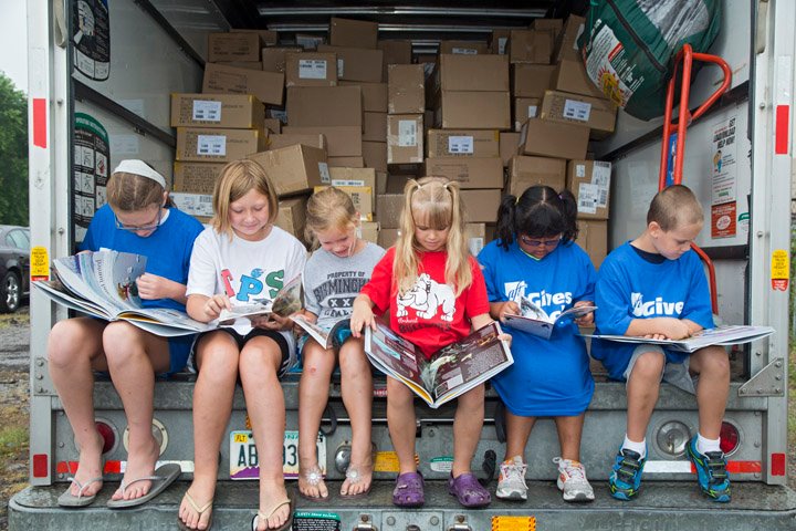Supplying books to kids in underserved communities significantly increase their interest in reading. Photo source: First Book