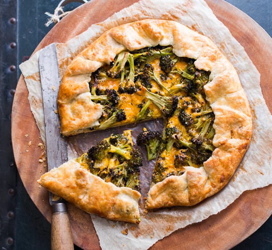 A savory pie without the fuss, a galette can be thrown together with whatever vegetables, cheeses, or spreads you have on hand. In this recipe, the broccoli lends a nice crunch to contrast with the soft dough. Pair with a salad and you’ve got dinner. Photo source: White on Rice Couple .