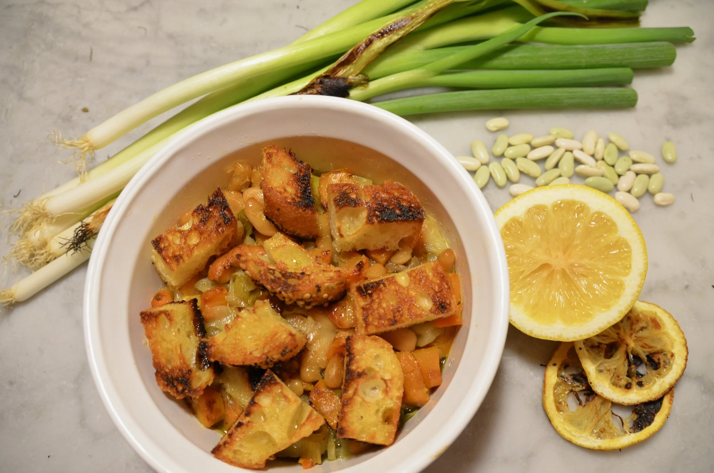 White Bean Casserole with Giant Croutons and Charred Lemon-Scallion Relish