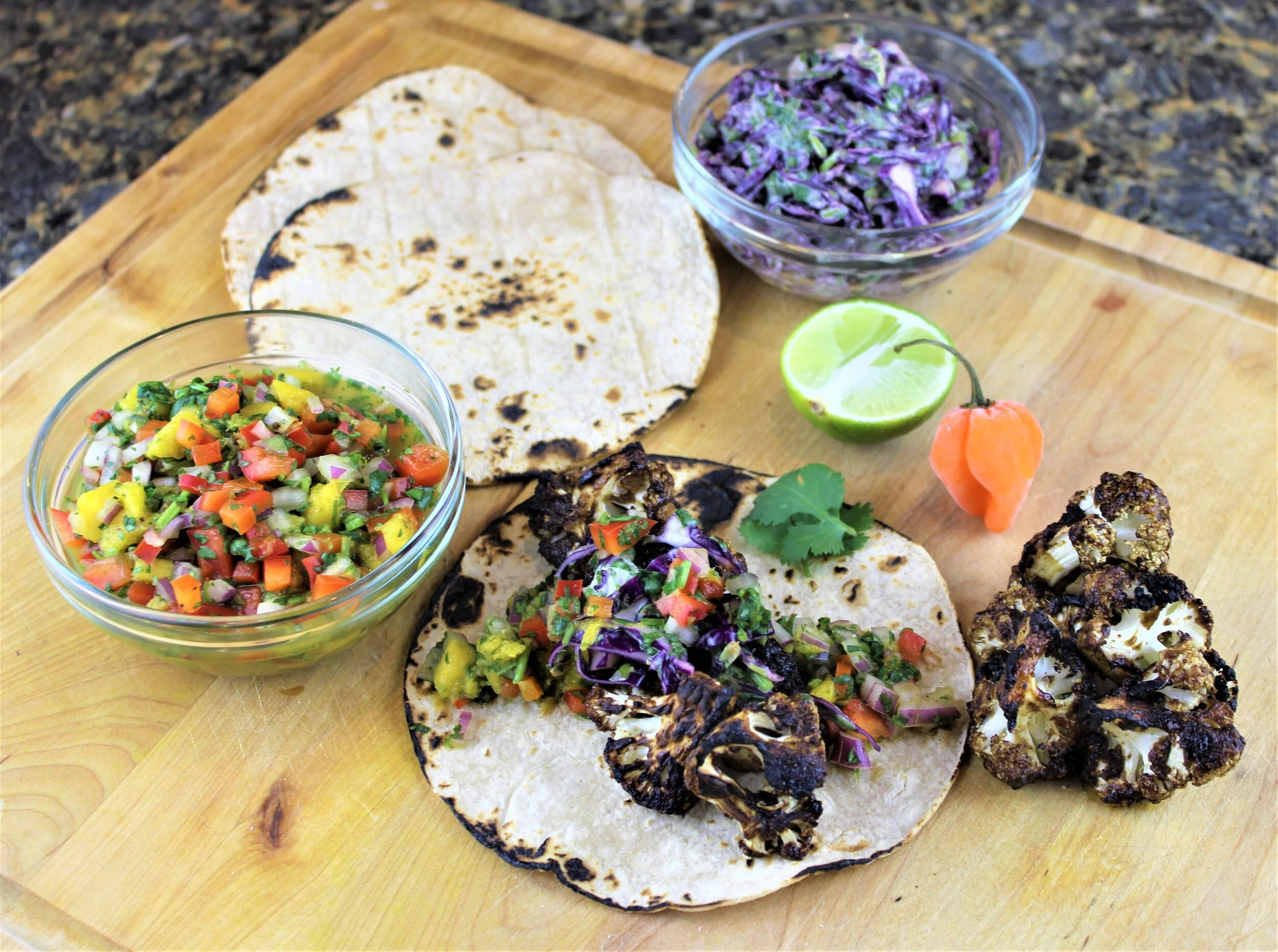 Jerk Cauliflower Tacos with Mango Salsa and Cabbage Slaw 
