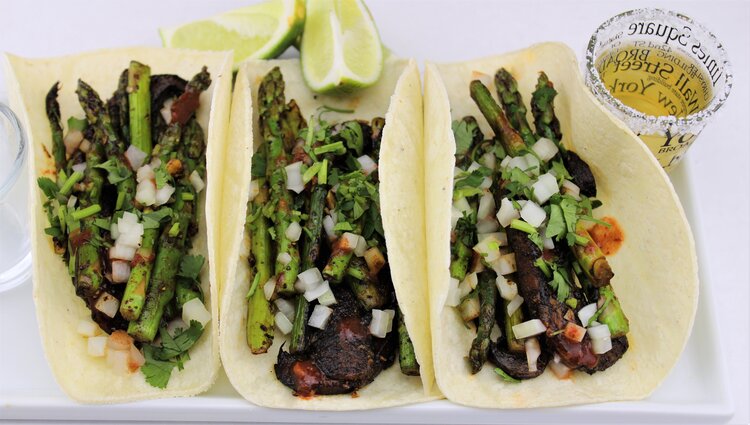 These hearty plant-based tacos come together in the blink of an eye. With meaty seared mushrooms and earthy asparagus, they pack a satisfying yet refreshing punch. Enjoy with the traditional toppings like chopped onions, lime, cilantro, and a shot o…
