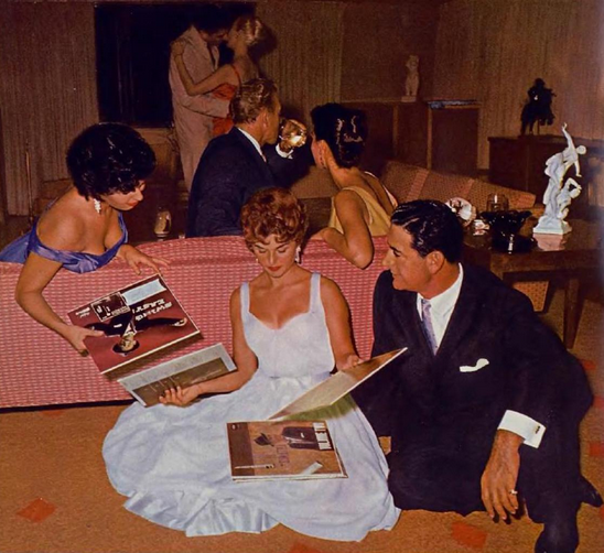 May 1959 Playmate of the Month posed at a record party