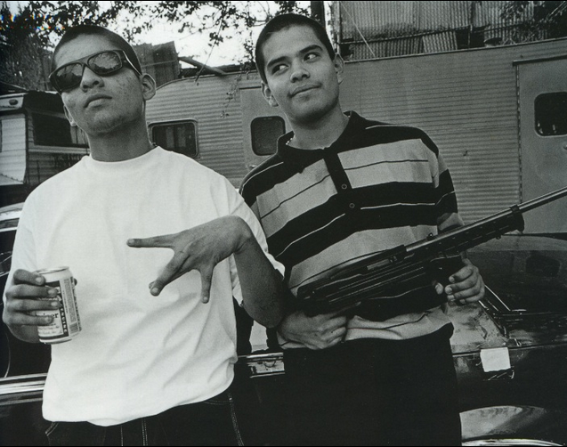 LA gang sign and gun