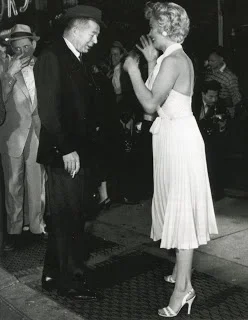 Marilyn with director Billy Wilder, planning the skirt-blowing scene (Sept. 1954)