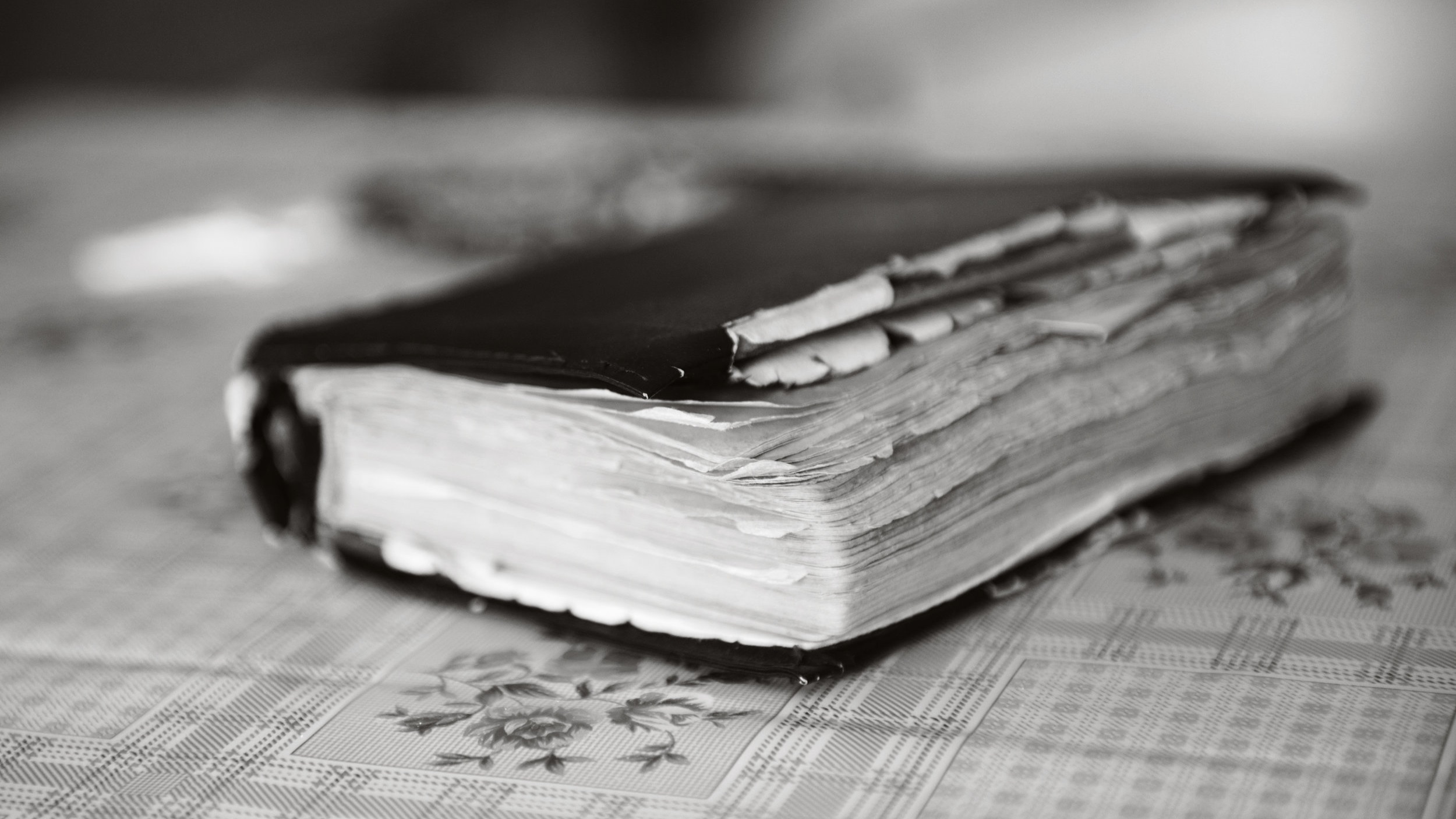 graphicstock-leather-covered-old-bible-lying-on-table_HR1ClUhbW.jpg