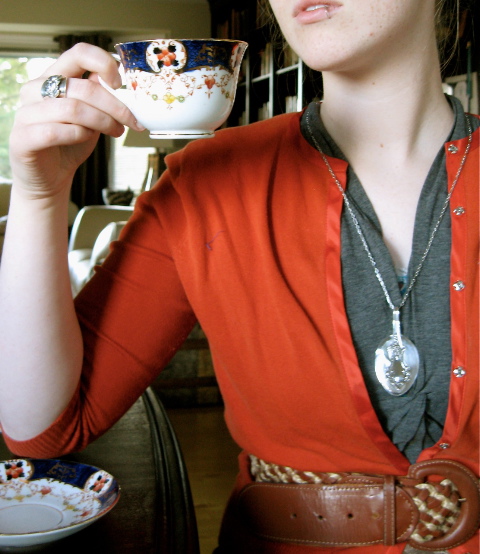 kelsey with folded pendant and ring with teacup.jpeg