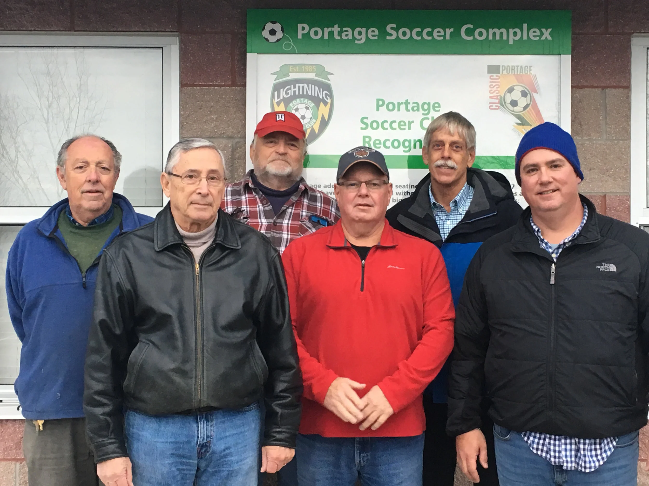 The "Grounds Crew," (from Left to Right) Verne Genisio, John Calnin, Mike Flynn, Mark Horning, Norm Jensen, and Sean Bowser. Not pictured, Paul Knight and Mike Rohrstaff
