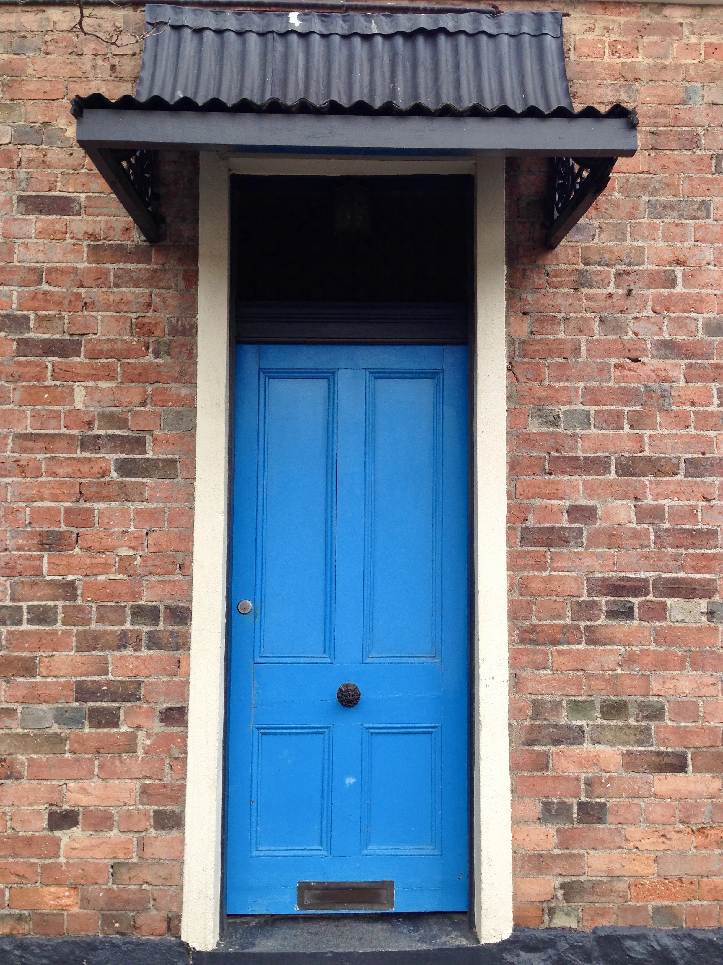 This is a door I spotted in one of Melbourne's northern suburbs. I love the textural mix of the brick wall, the timber door and the hotch potch corrugated awning. The only thing missing is a peep hole! I'd want to have a look before I opened the door.