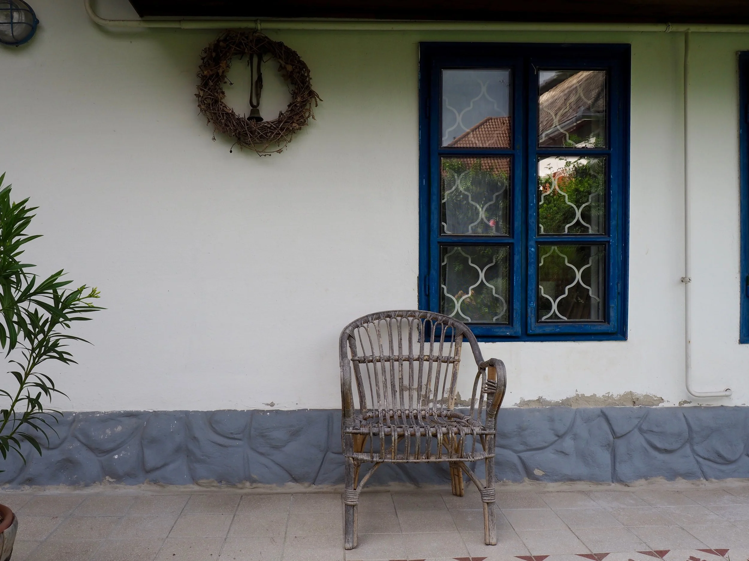 A beautiful old cane chair that not only looks great on the porch but is functional too. 
