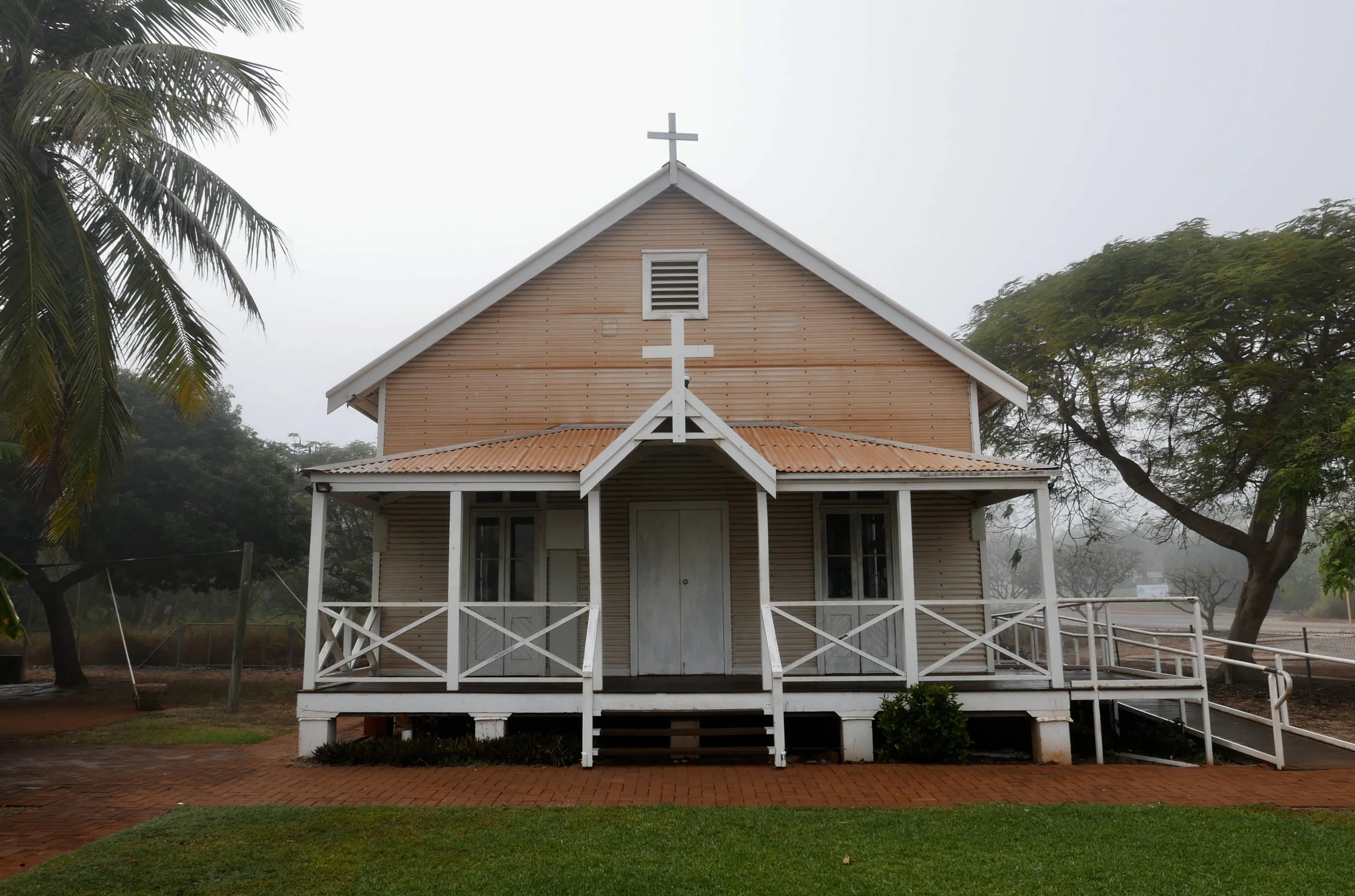 This charming little church just stole my heart. I love the shape and the architectural simplicity and also, what I thought was a peachy coloured paint. Upon closer inspection I discovered it was in fact the red pindan soil that had settled on it. I captured this moody and tropical looking image on a foggy day which is a real rarity in the dry season.
