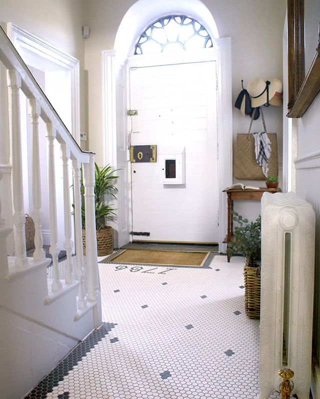 Entrance hall #beforeandafter lots of sleepless nights about flooring for this space. Timber or tile. Went with #mosaic tiles and added the year the house was built into it. Swipe to see. We replaced the rad with a cast iron one with decorative flora