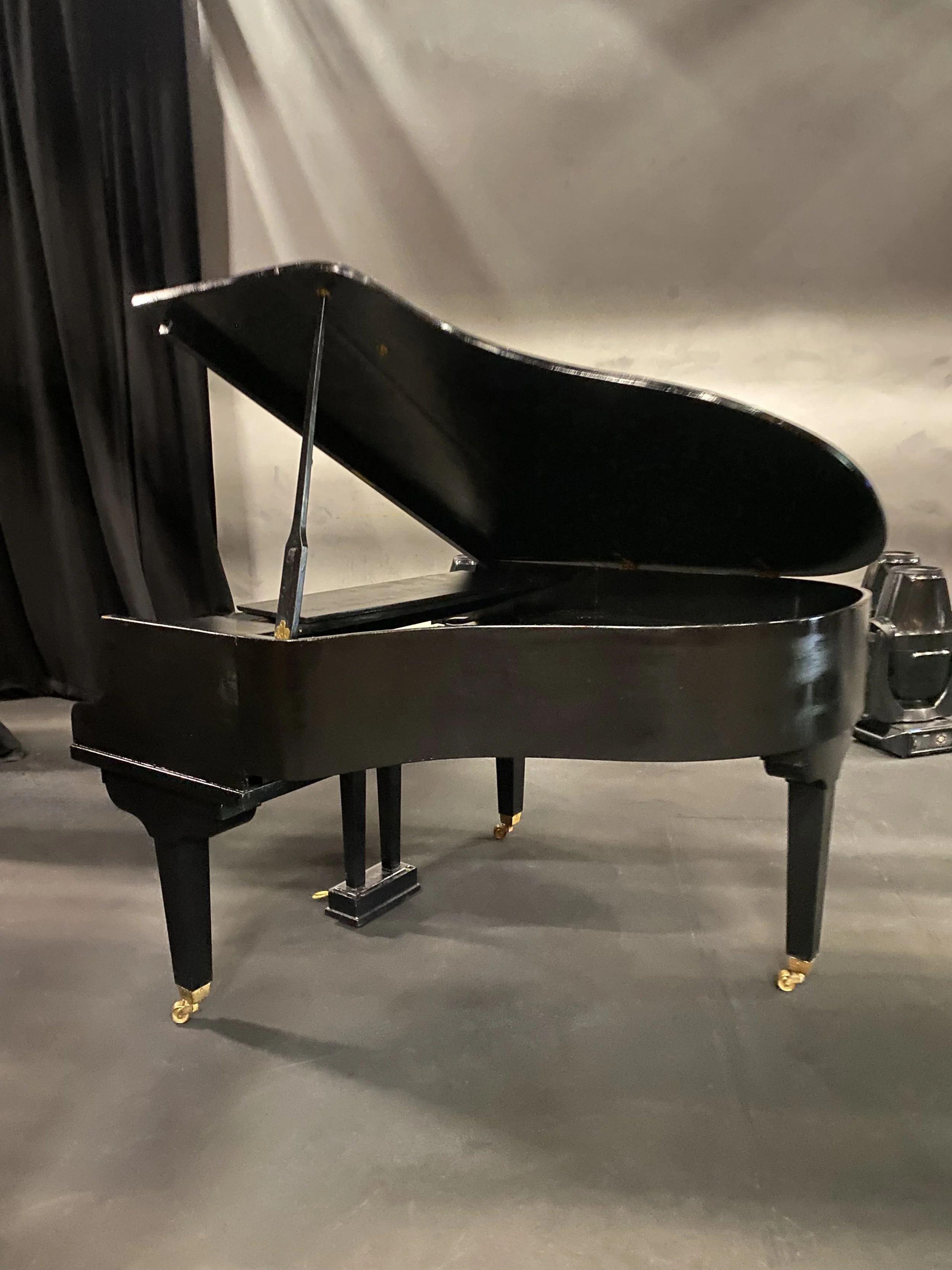 Baby grand piano shell with keyboard available to hire