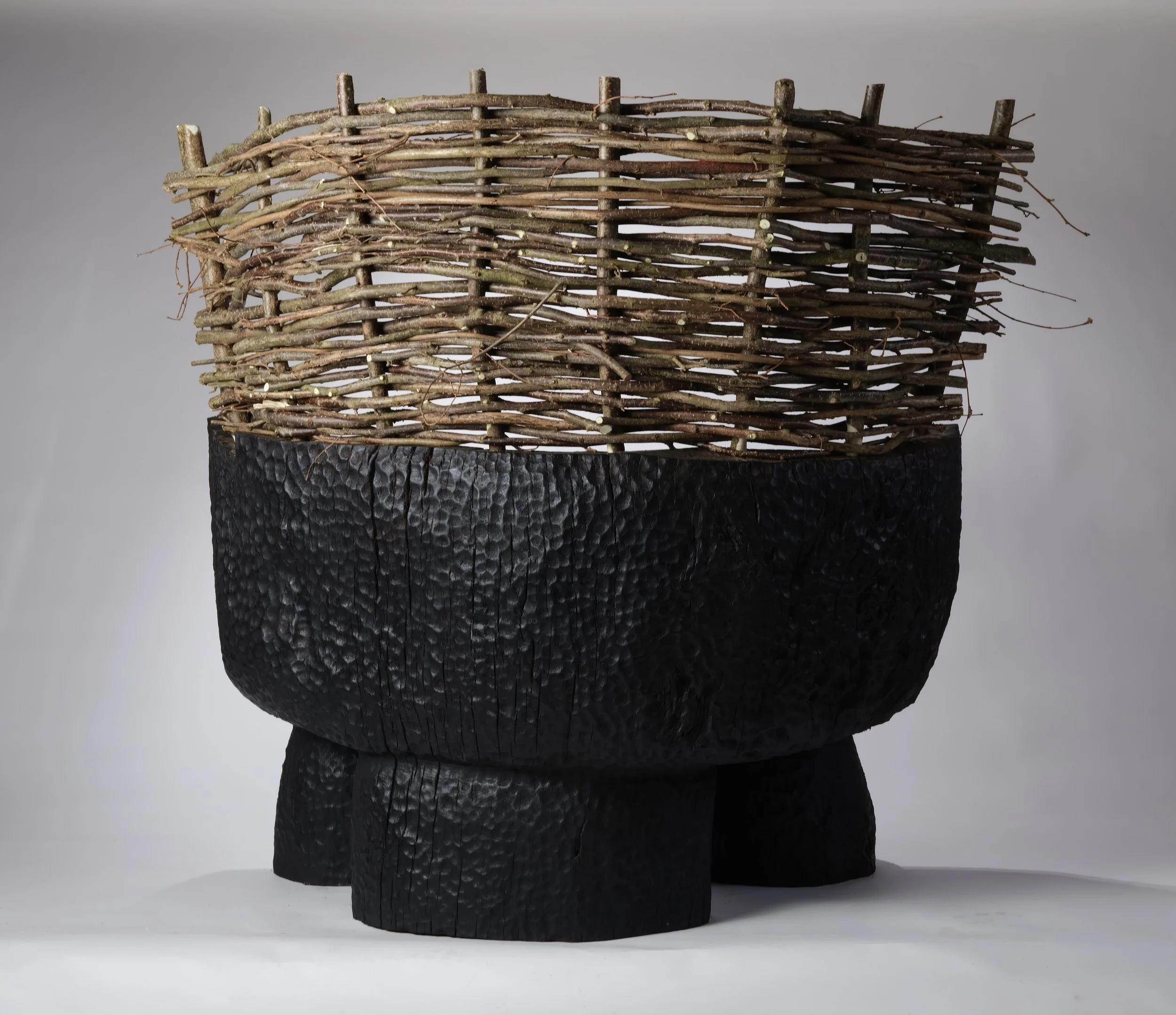 Rear view of a carved and woven Oak/Hazel seat