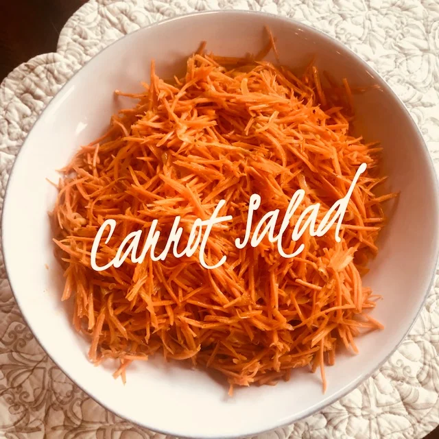 Recipe: 4 large carrots 1/4 cup olive oil 1 clove garlic 1 small onion thinly sliced 2 tbsp. apple cider vinegar 1 tsp coconut sugar or honey 1 1/2 tsp coriander 1/2 tsp chili powder 1/2 tsp salt pepper to taste Shred carrots using a julienne grater (cheese grater will work but make smaller carrot shreds). Sauté thinly sliced onions in olive oil and garlic until soft. Add onion and oil to shredded carrots. Add other ingredients and stir. Serve at room temperature. Even better the next day!