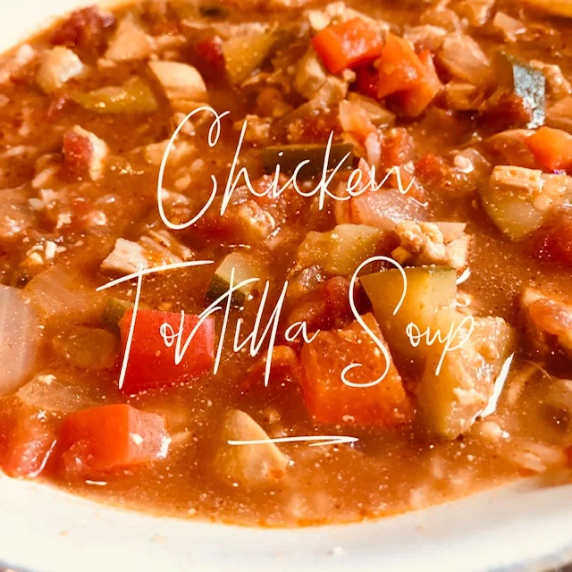 Recipe: 2 lbs. boneless skinless chicken thighs 1 cup water 1 tbsp. olive oil 1 onion 2 zucchini 2 red peppers 2 tbsp. cumin 2 tbsp. chili powder 1 tbsp. minced garlic 1 tbsp. hot sauce (or to your taste) 2 15 oz. can of petite diced tomatoes 1 15 oz. can of tomato sauce 4 cups chicken broth salt/pepper Cook chicken in pot with water. Remove from pot and set aside. Heat oil and toss chopped onion. A few minutes later add chopped zucchini and peppers. Flavor with the spices and stir until veggies soft. Add hot sauce, tomatoes, tomato sauce and chicken broth. Add chopped chicken. Salt and pepper as desired. Bring to a boil and then simmer for a few minutes. Garnish with avocado, sour cream or cilantro!