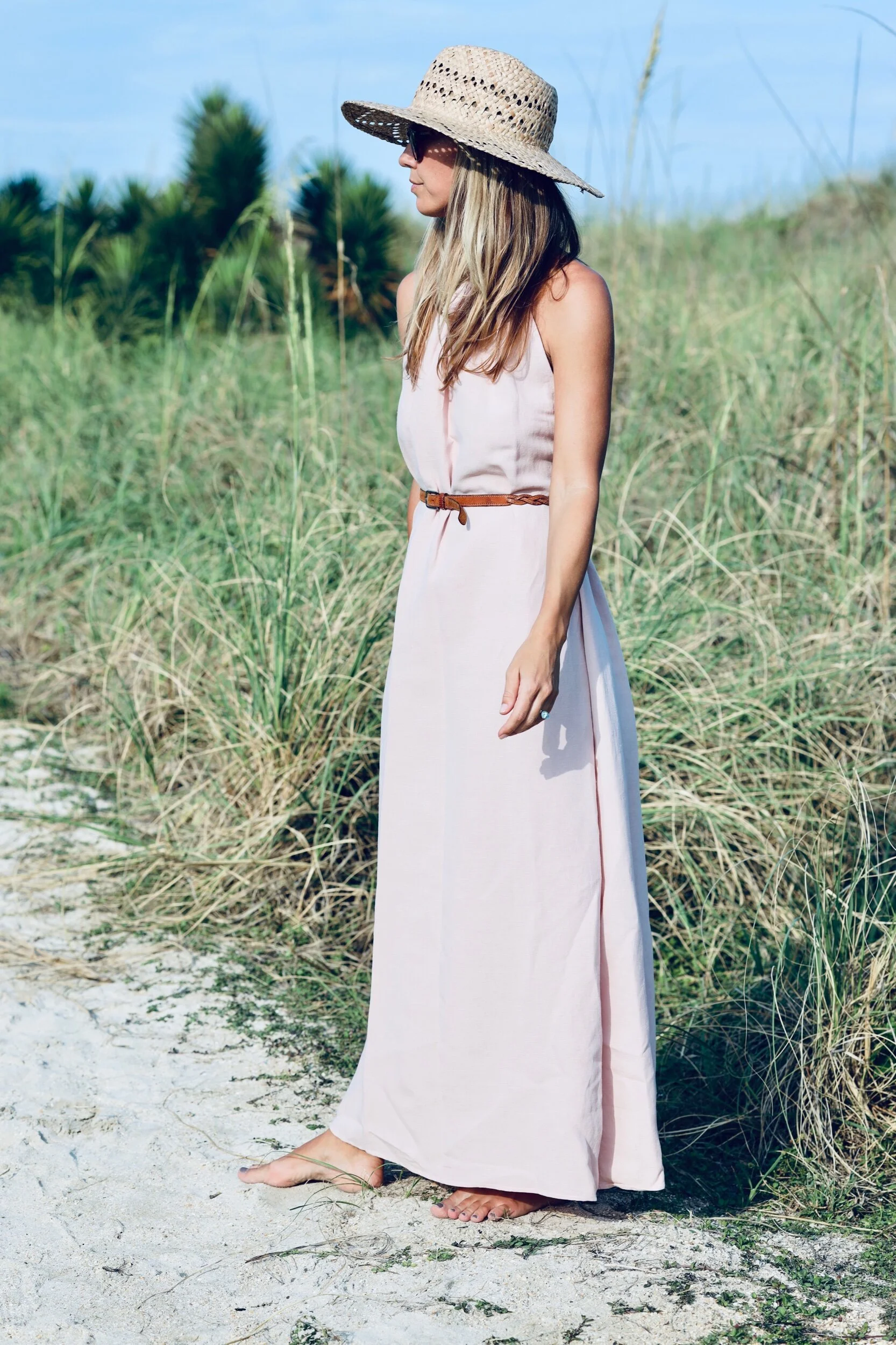 Woman wearing white linen dress.