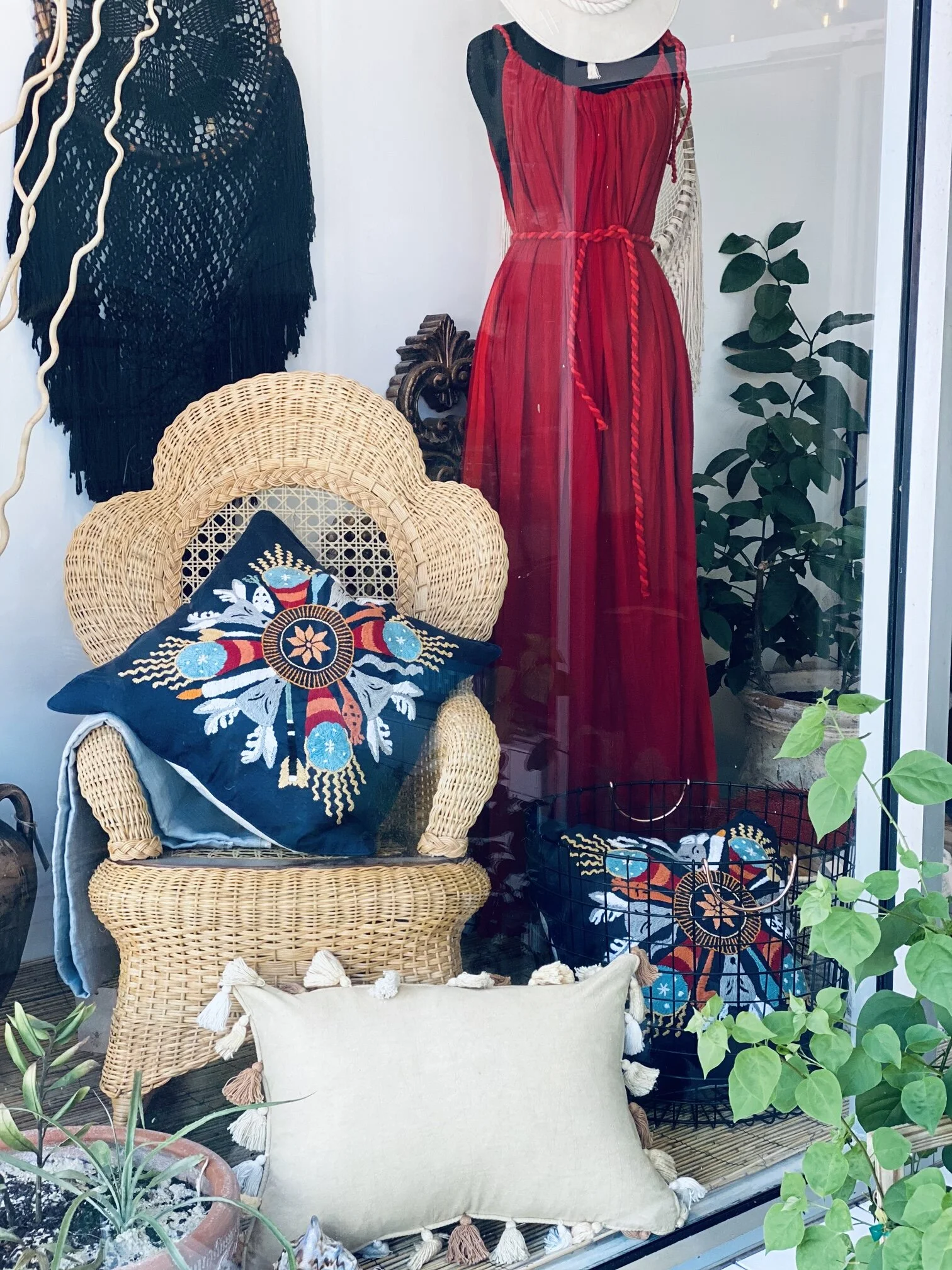 Blue pillow case with patterns on chair.