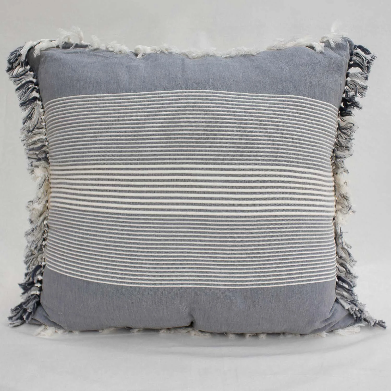 Grey and white striped pillow on white background.
