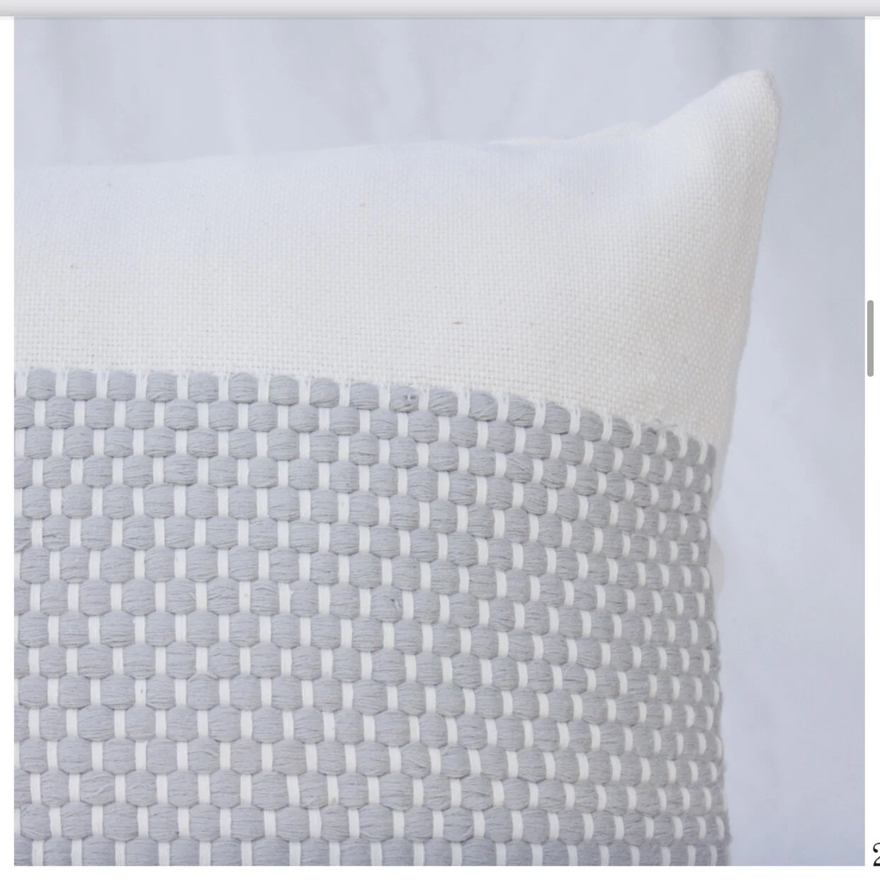 Grey dotted square pillow.