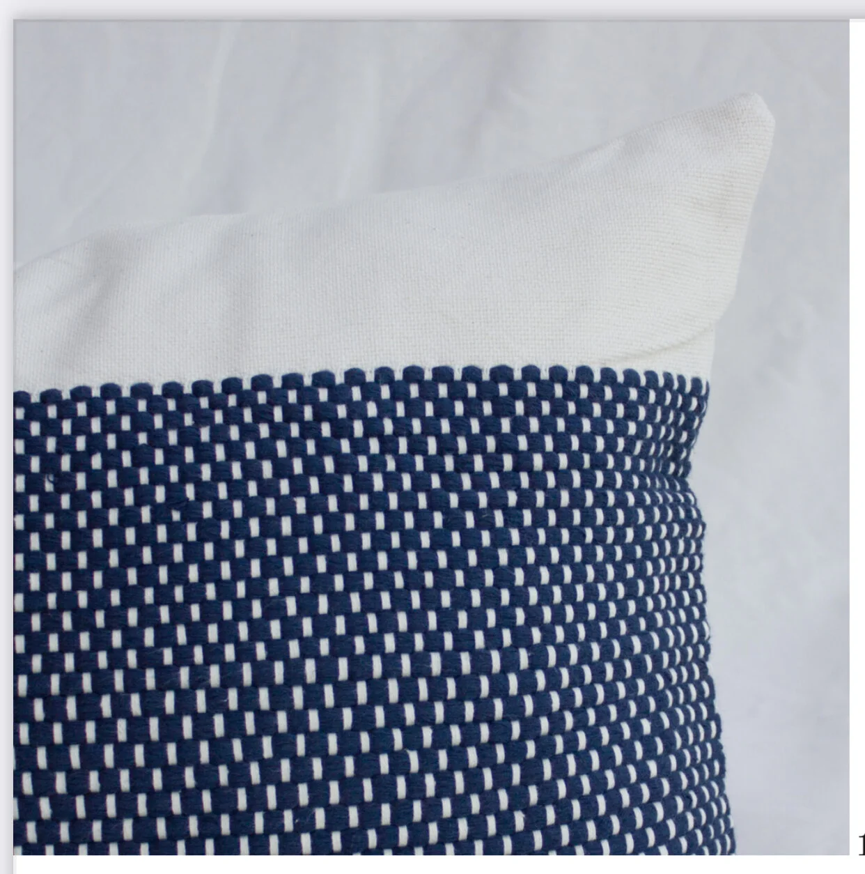 Black and white dotted pillow case.