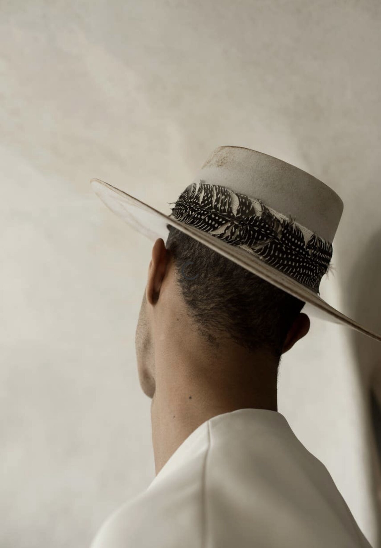 Man wearing white wool hat.