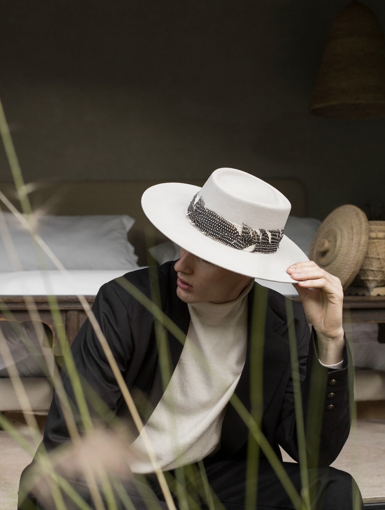 Man wearing white wool hat.
