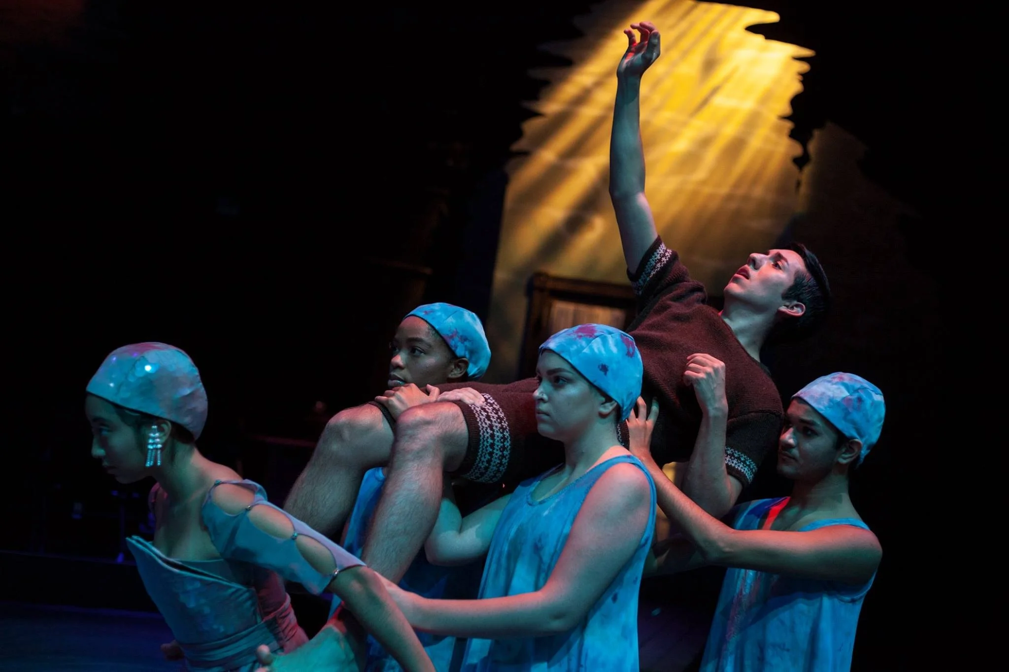 Devin Ramirez as Charles, Guinevere Govea as ( ), and Carlie Schoultz, Kialond Bronson-Smith, and Nick Salvidar in the Movement Ensemble. Photo by Lawrence Peart.