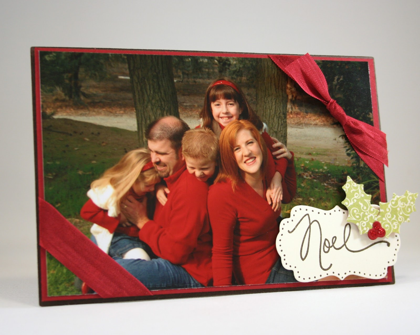 The Christmas Card that stands up! I created this using the Card and Photo Easel Die , which also includes the holly leaf shapes.