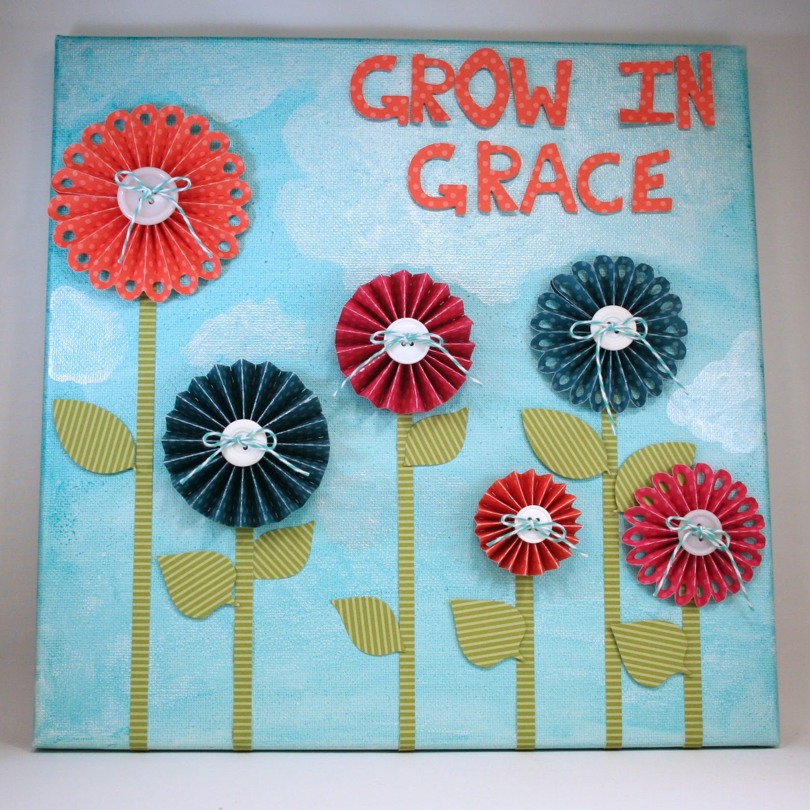  This canvas wall hanging also uses the  Rosettes Die &nbsp;set. &nbsp;I love how this set has a scalloped edge rosette and a straight edge rosette. &nbsp;Simply cut and trim to create various sizes! 