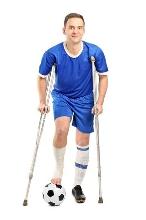 The coach probably won’t play this player until he is off crutches and completely healed. The same is true of a dog with a behaviour problem; we don’t want to re-injure your dog by triggering the problem over and over again. Copyright: ljupco / 123R…