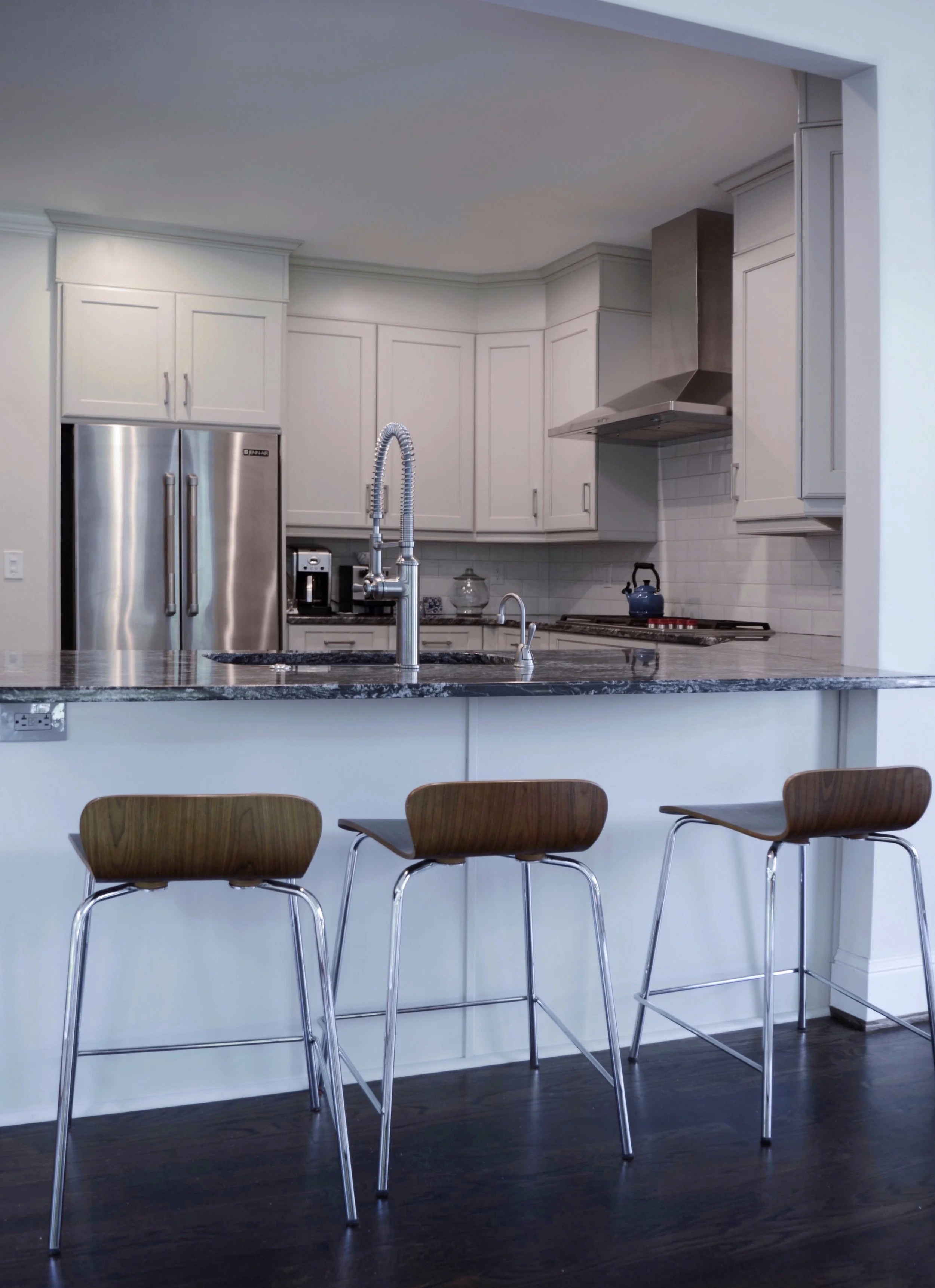 After: The enlarged breakfast bar now includes the sink and more room for seating.