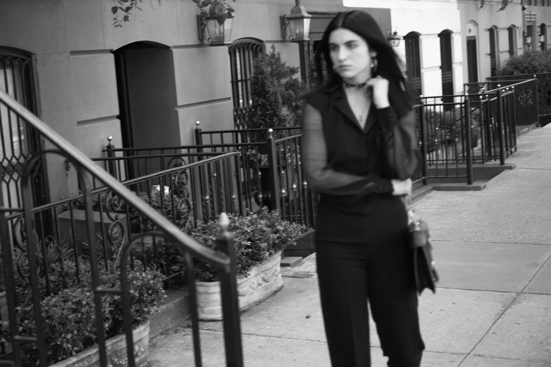 Jumpsuit: Vintage Yves Saint Laurent Le Smoking; Sneakers: Adidas; Bag: Vintage Gianni Versace; Bracelet: Avocet Jewelry; Necklace, Black Stone Ring: Alibi; Brass Arco Ring: Pamela Love; Choker, Earrings, Left hand rings: Tali’s own