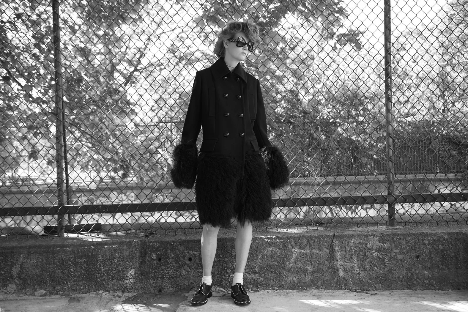 coat : SACAI sunglasses: ROBERTO CAVALLI shoes : ALEXANDER WANG courtesy of ALBRIGHT FASHION LIBRARY socks : FOGAL