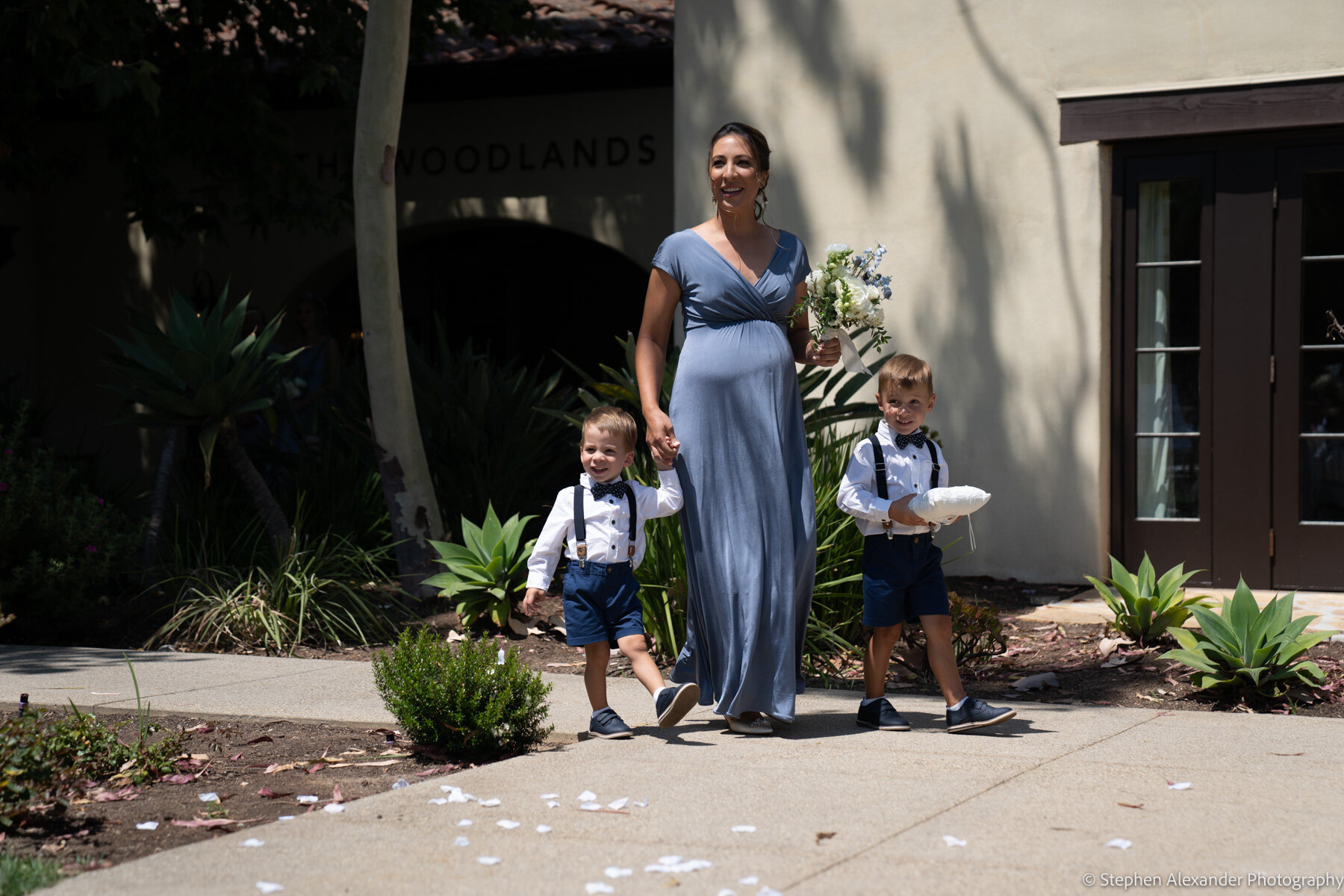 the ring-bearers were on point with some help from their mom.