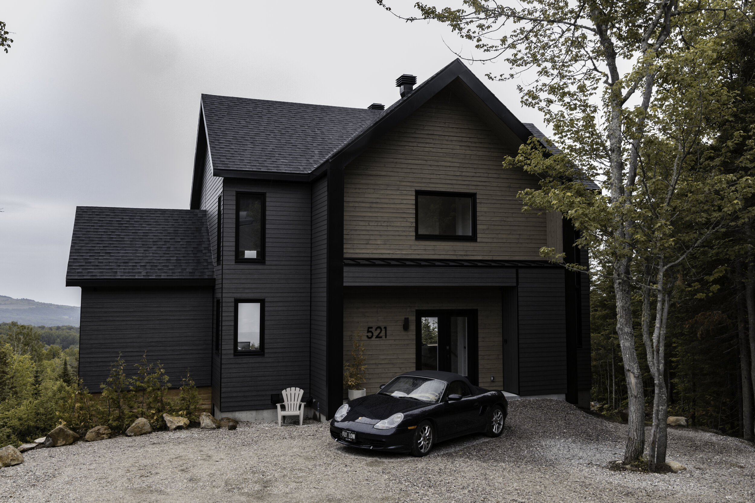 Large luxury chalet in Quebec (Charlevoix Region) with a Porsche car parked out front