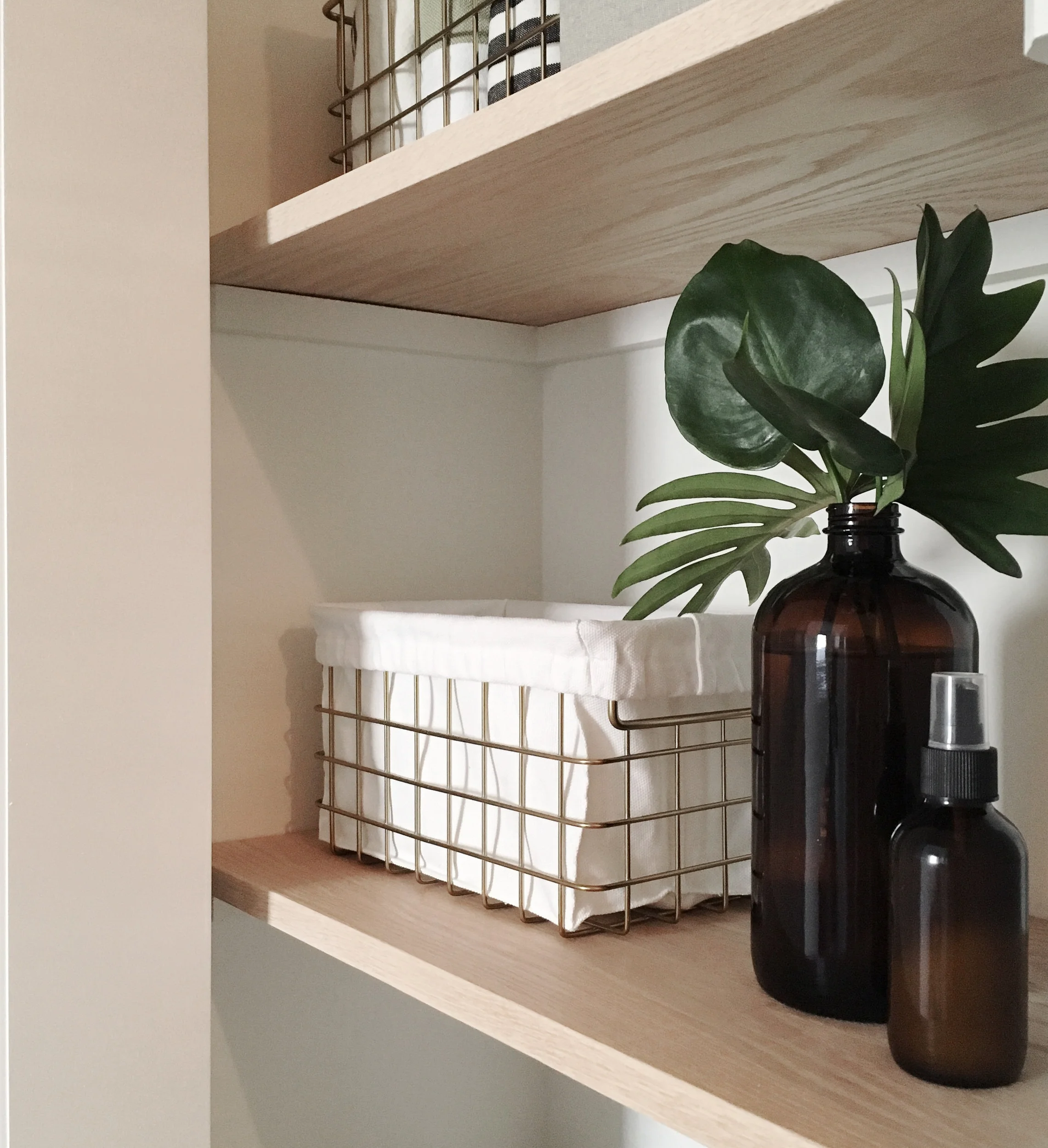 Oak boards from Home Depot cut down to size add a nice, natural warmth to the predomindantly gray and white space.