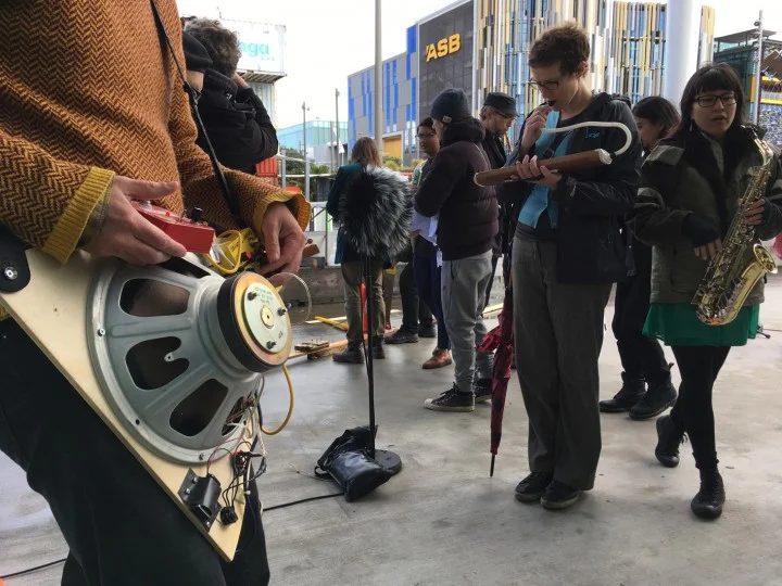 Ivan Mršić, Kakokarangaphonia Orchestra , 2016. A collaborative offsite performance, 12pm - 1pm, 15 October 2016, Karanga Plaza, Wynyard Quarter, Auckland. Commissioned by Te Tuhi, Auckland. Photo by Bruce E. Phillips