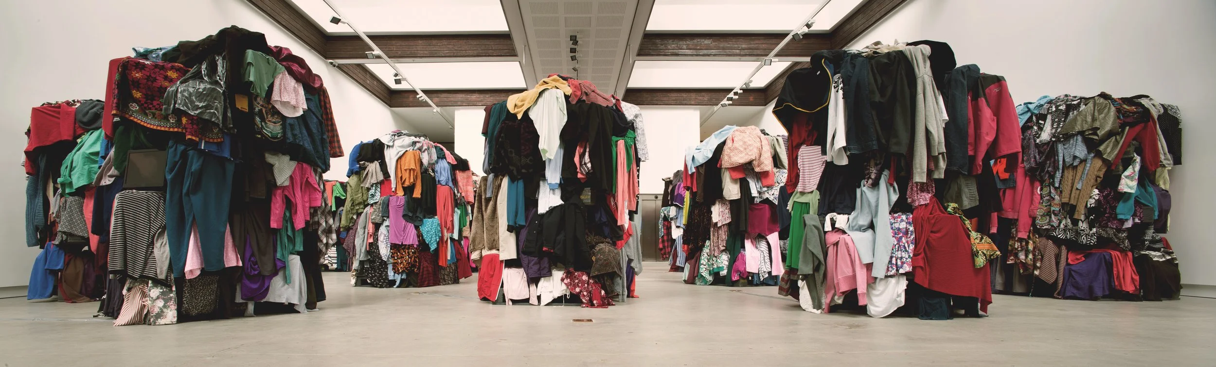 Ruth Watson, Geophagy , 2018 (detail). Installation with recycled pallets, second-hand clothing, monitors with 5-single channel, looped HD videos.