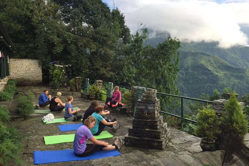 Yoga set against mountain views and nature