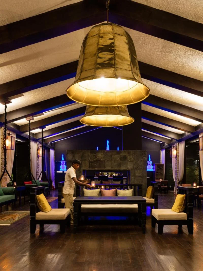 Open fire and dining room at The Pavilions