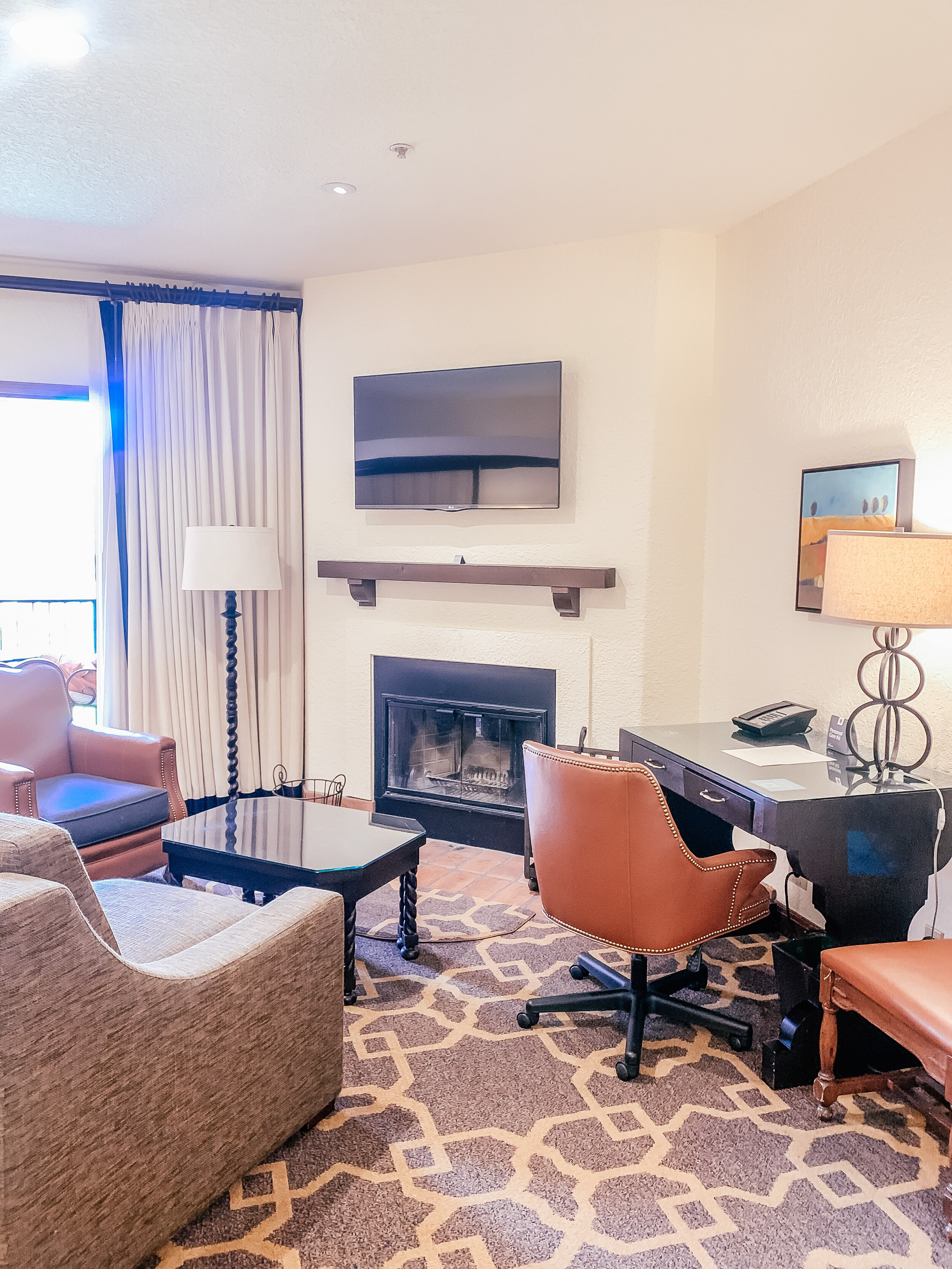 Fairmont Sonoma Mission Inn & Spa Review  - Rooms at the Fairmont Sonoma - Mission Suite - Sofa bed and fireplace.JPG