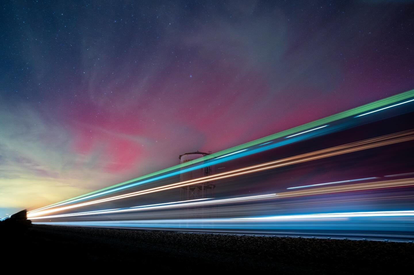 Ghost in the night. On November 11, 2025 the sky exploded with the aurora overhead and our  eyes could see the hues in the sky. The roar of the train in the distance announced its approach. I felt the wind and speed and with the aurora in the backgro