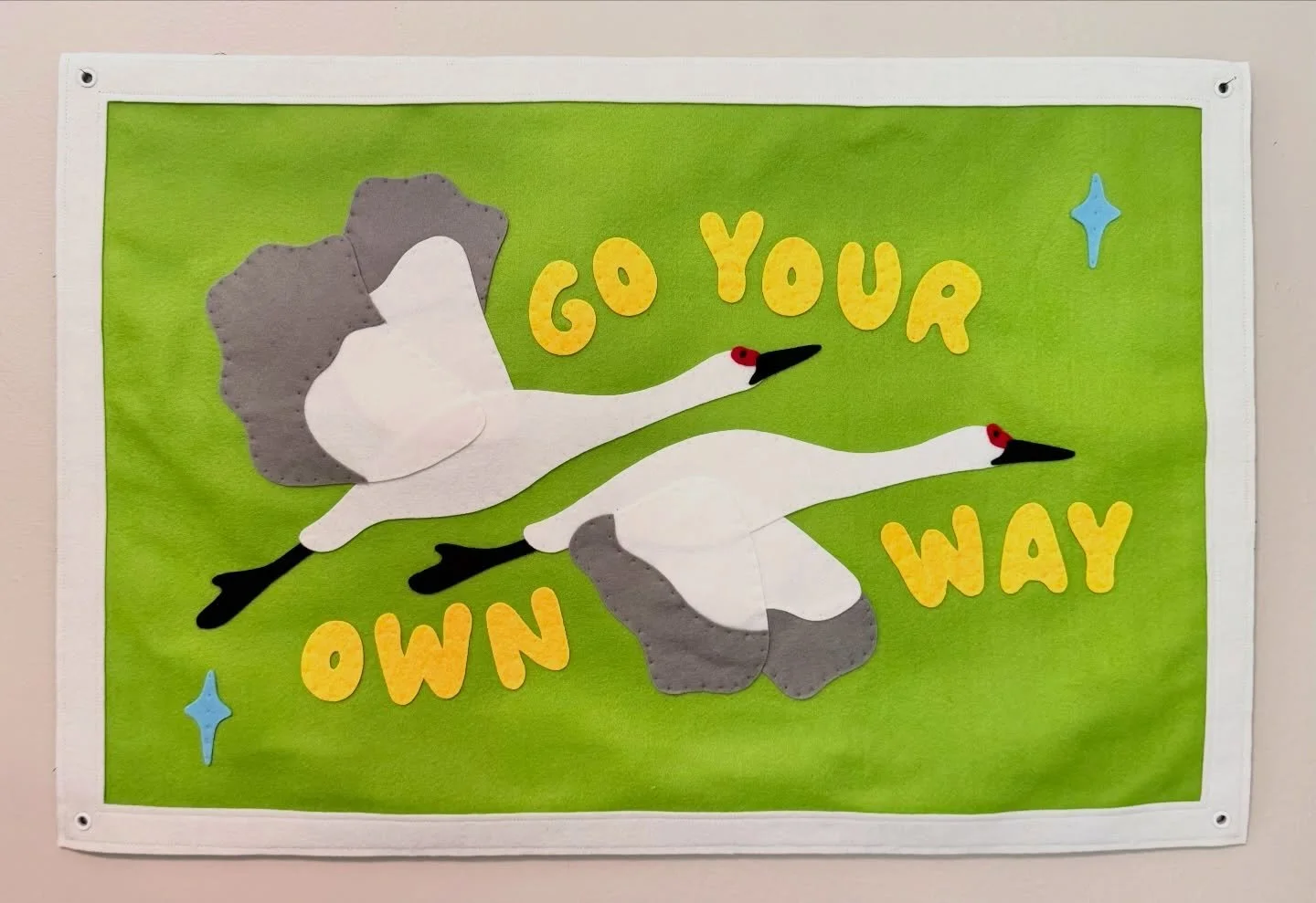 Wrapped up this cute banner a few weeks ago and even though I posted a process video I realized that I never posted the finished piece, so here she is! 🪶✨

#goyourownway #feltbanner #fiberart #fiberartist #illustrator