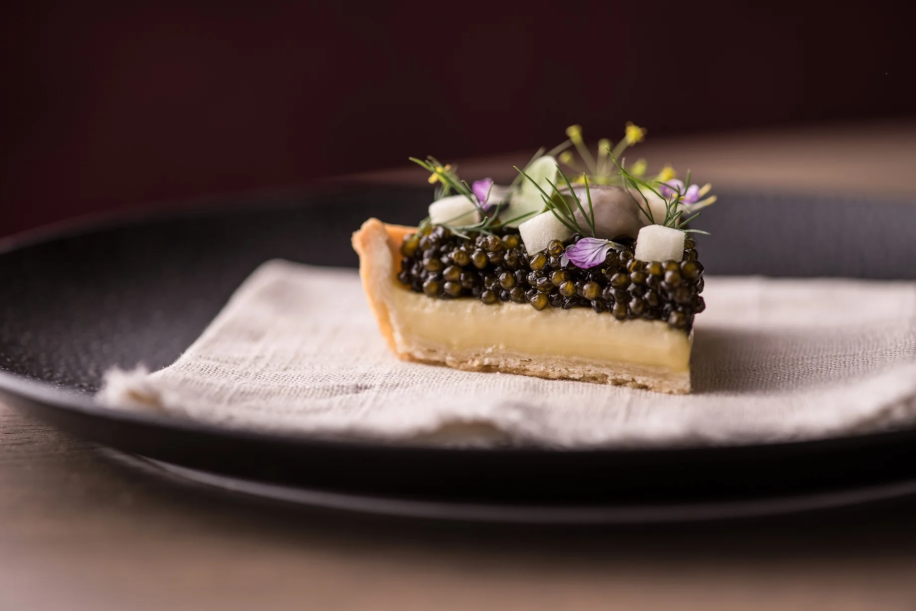 Oyster Pie ( a savory oyster custard topped with osetra caviar, a touch of creme fraiche, green apple dressed with lemon & dill ): Photo credit Anthony Tahlier