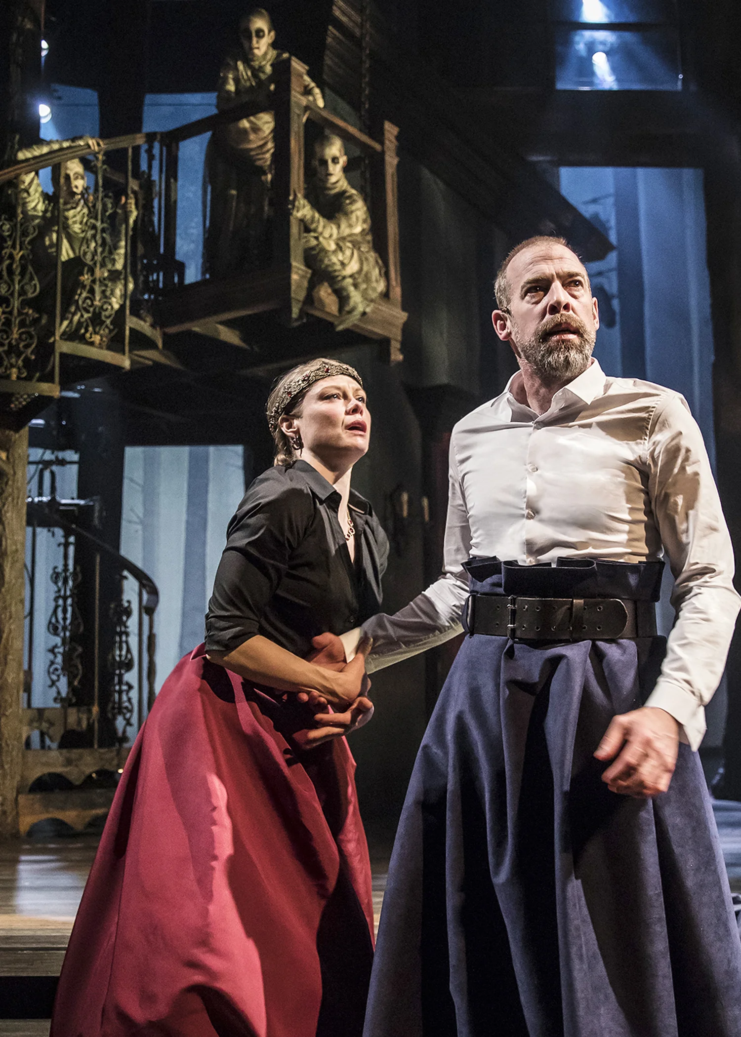 Macbeth (Ian Merrill Peakes, right) and Lady Macbeth (Chaon Cross) ascend to power, observed by the Weird Sisters. Photo by Liz Lauren.