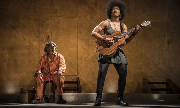 Ernest Perry Jr. (The Oldest Old Man) and Melody Angel (Musician) in "Father Comes Home from the Wars (Parts 1, 2 & 3)". Photo courtesy of Goodman Theatre.