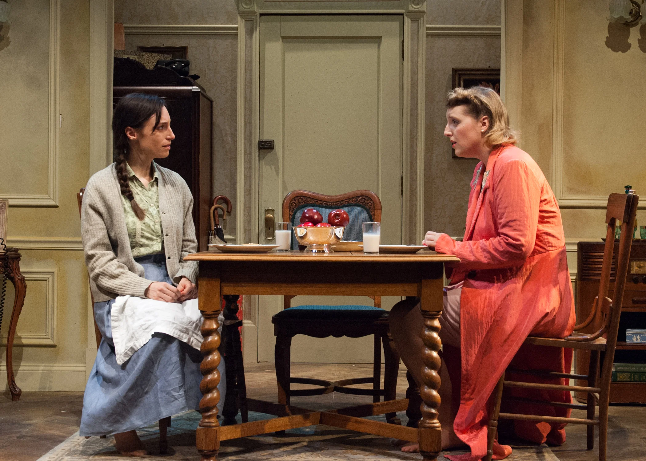 Left to right, Emily Berman and Bri Sudia as two sisters trying to reconnect after years of separation brought on by the rise of the Nazis in Timeline Theatre’s production of A SHAYNA MAIDEL.