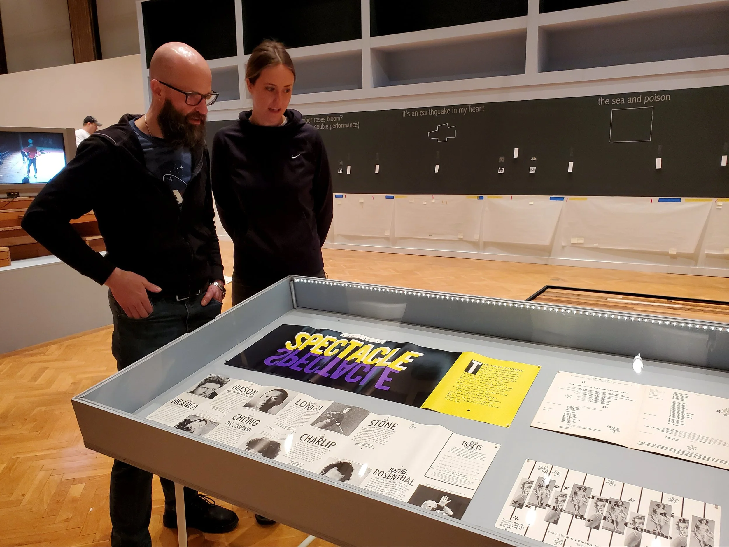 Goat Island Archive curator Nicholas Lowe and Sarah Skaggs looking at one of the Goat Island Archive displays